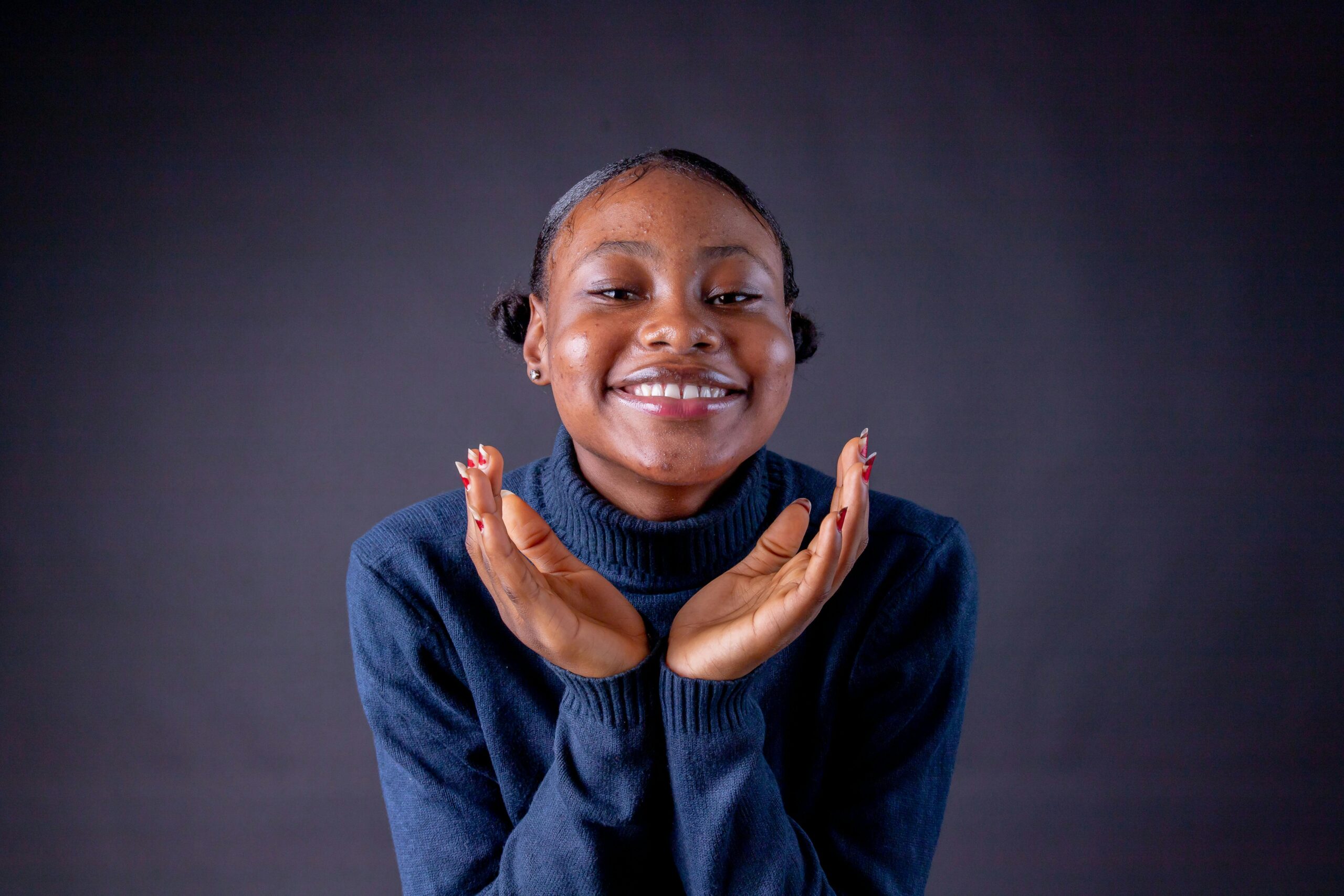 Smiling Woman in Blue Sweater