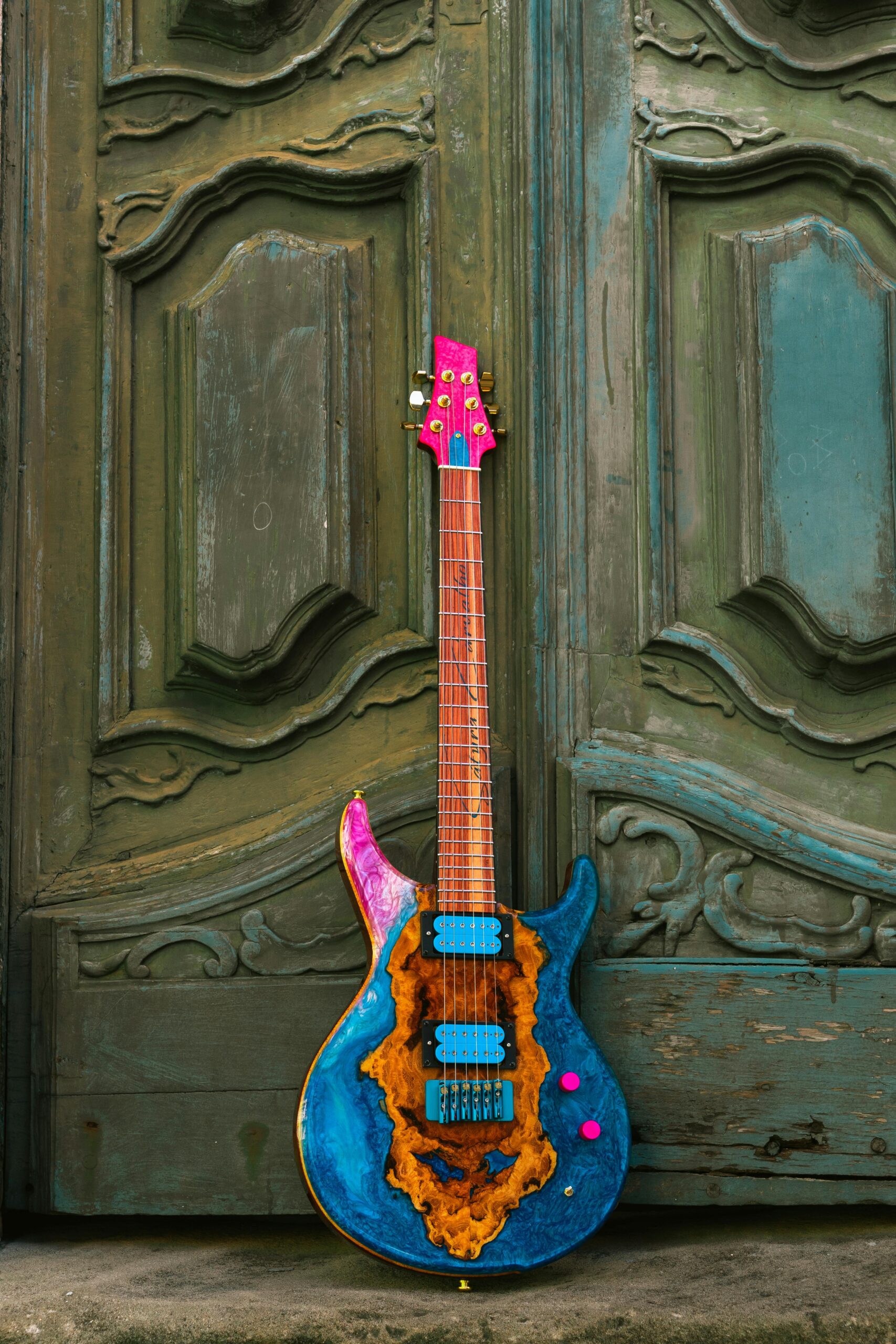 Electric Guitar Leaning on Wooden Door